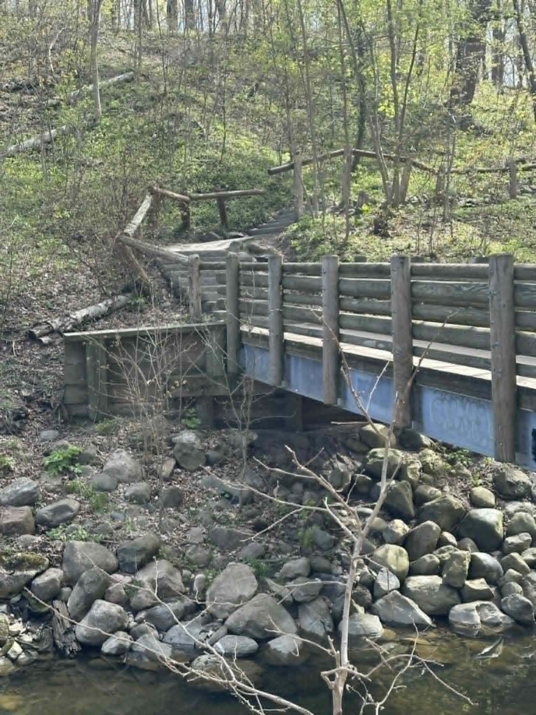 Wooden bridge crossing over ravine on Seven Bridges Trail