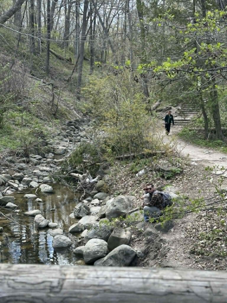 Visitors walking along trails in Grant Park near the lake