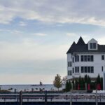 Mackinac Island waterfront with the Round Island Lighthouse on an overcast October day
