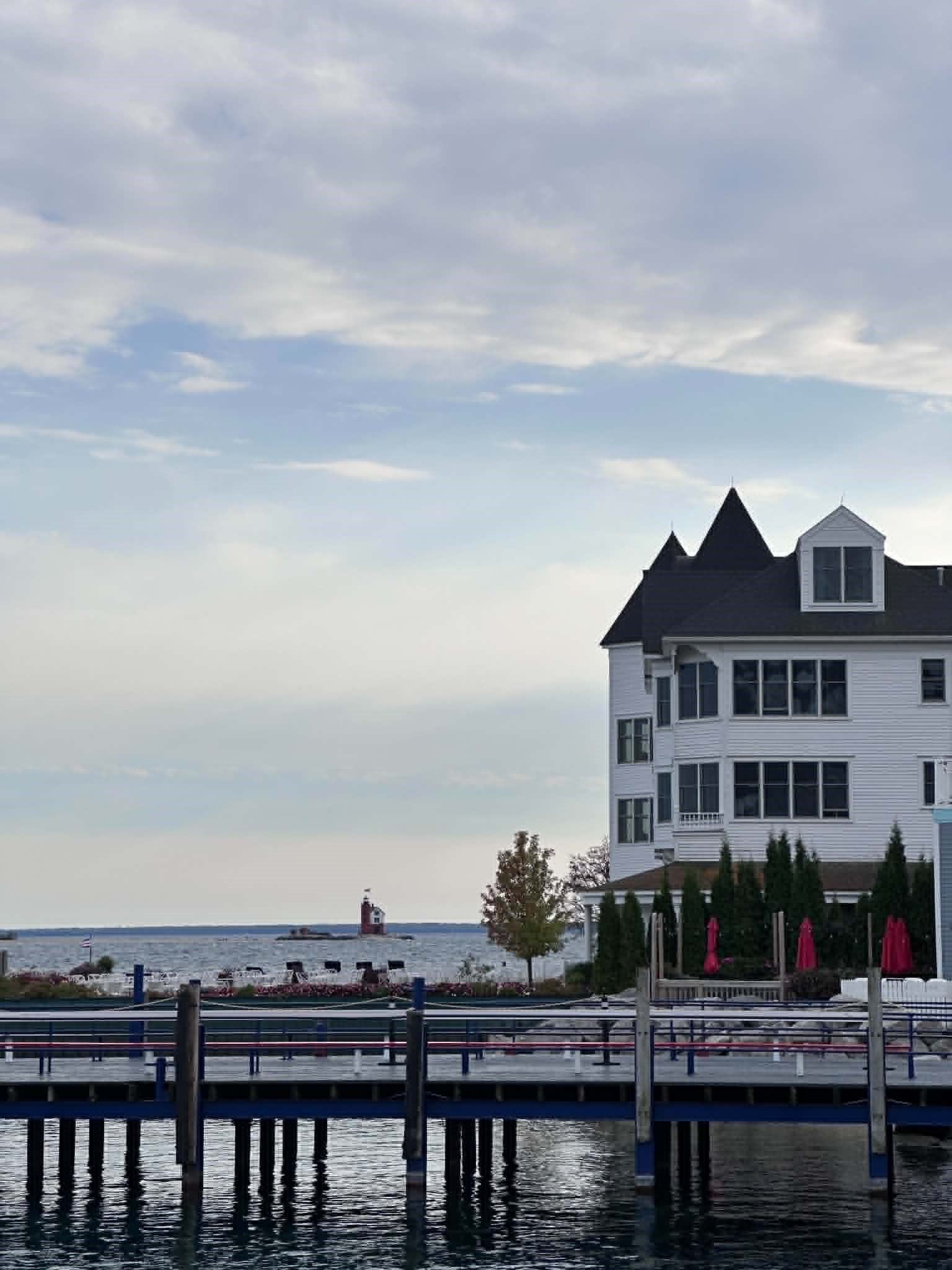 Mackinac Island waterfront with the Round Island Lighthouse on an overcast October day