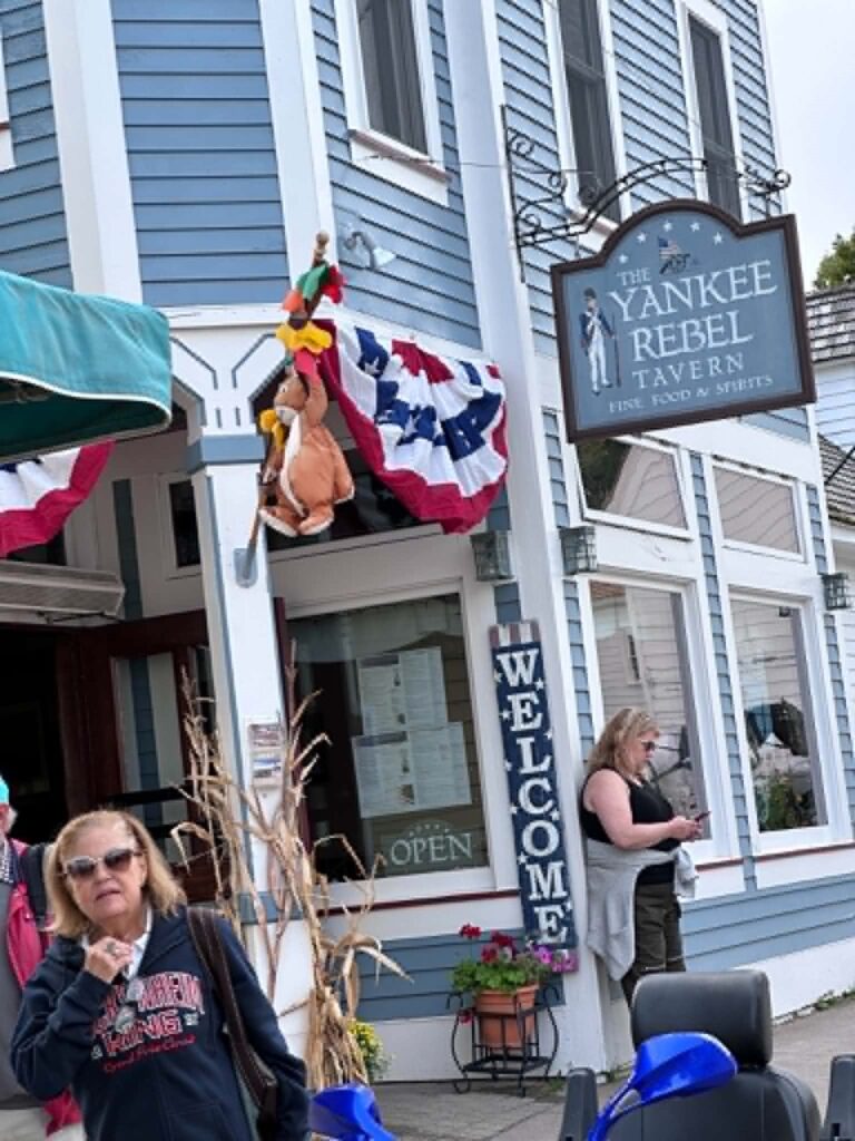 The Yankee Rebel Tavern storefront on Mackinac Island decorated for fall