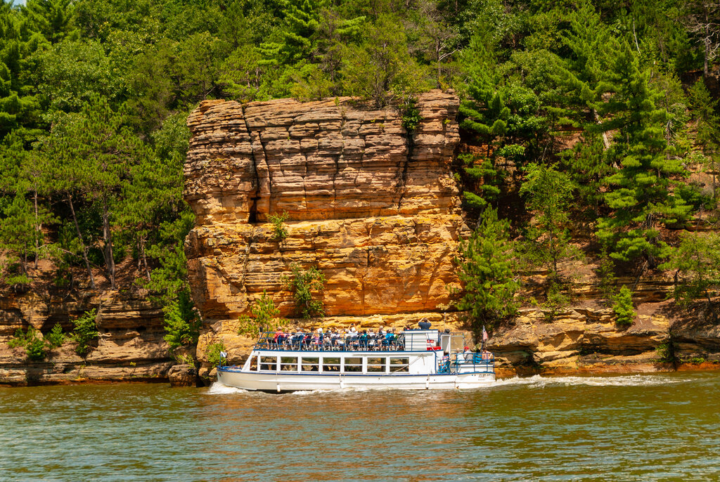 Beautiful Upper Wisconsin Dells Cliffs and Canyons with boat tour in front of the rocks 