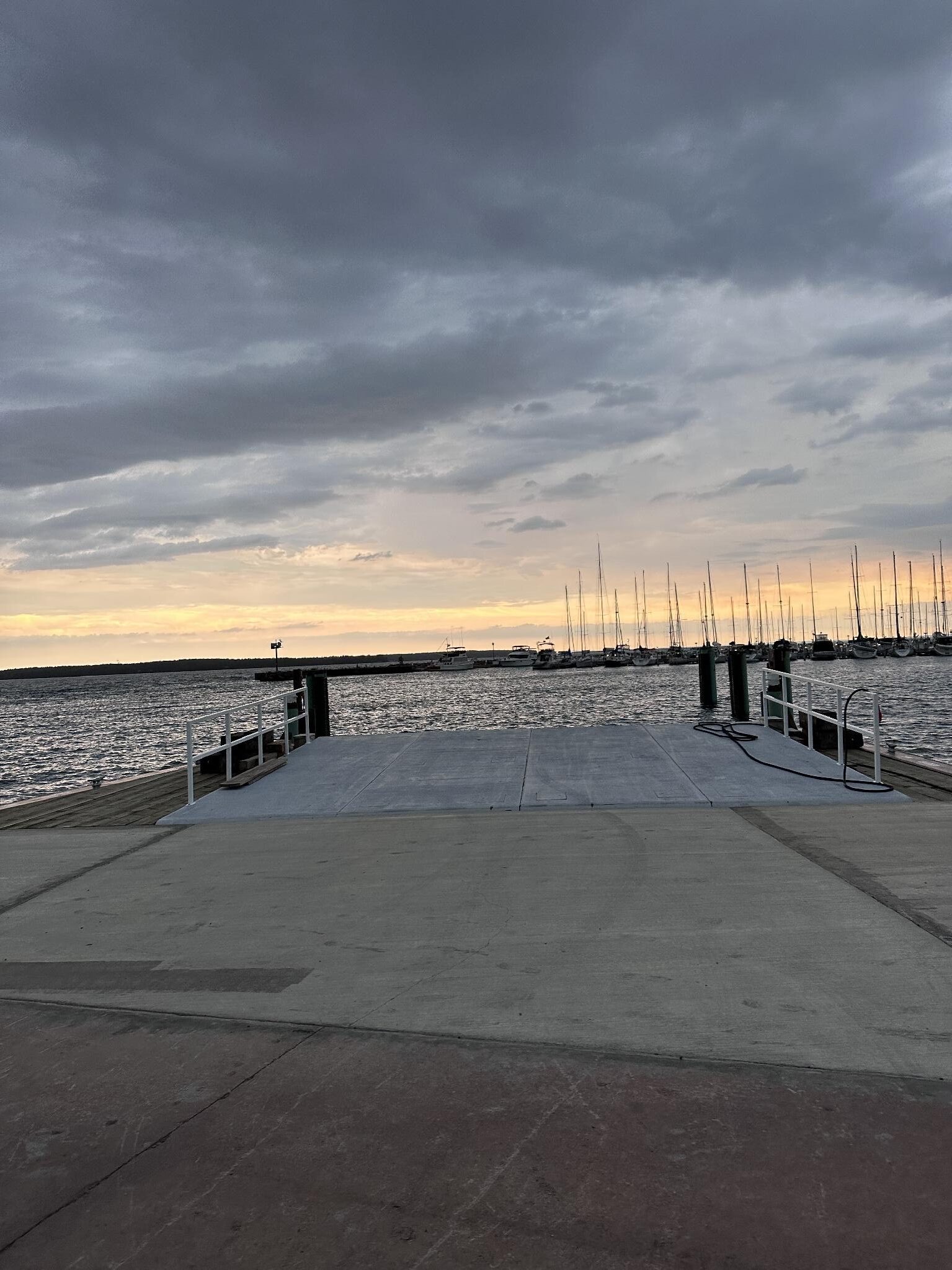 Level concrete boarding ramp with railings at Apostle Islands Cruises dock