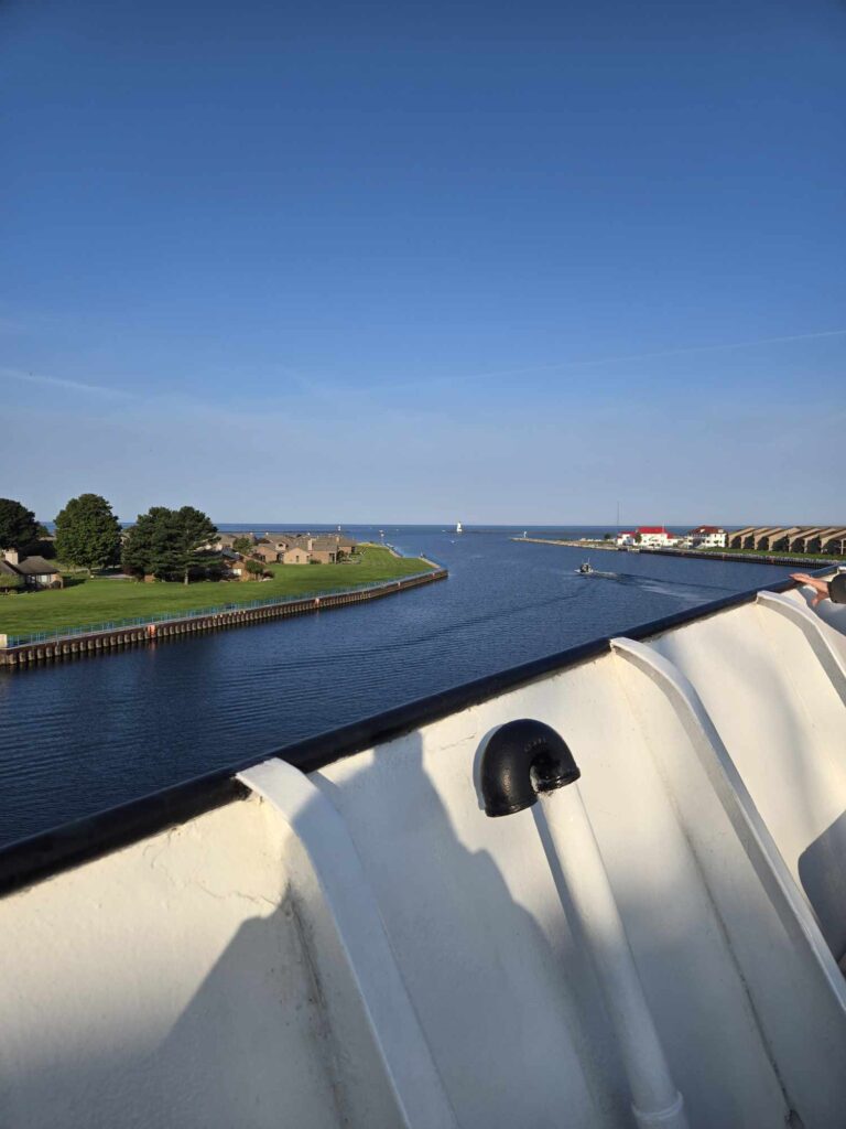 Ludington North Breakwater Lighthouse and Lake Michigan ahead from SS Badger upper deck departing Ludington harbor channel