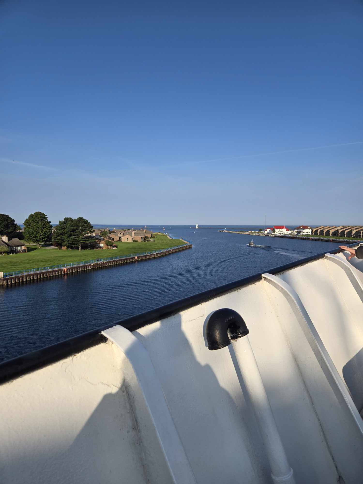 Ludington North Breakwater Lighthouse and Lake Michigan ahead from SS Badger upper deck departing Ludington harbor channel
