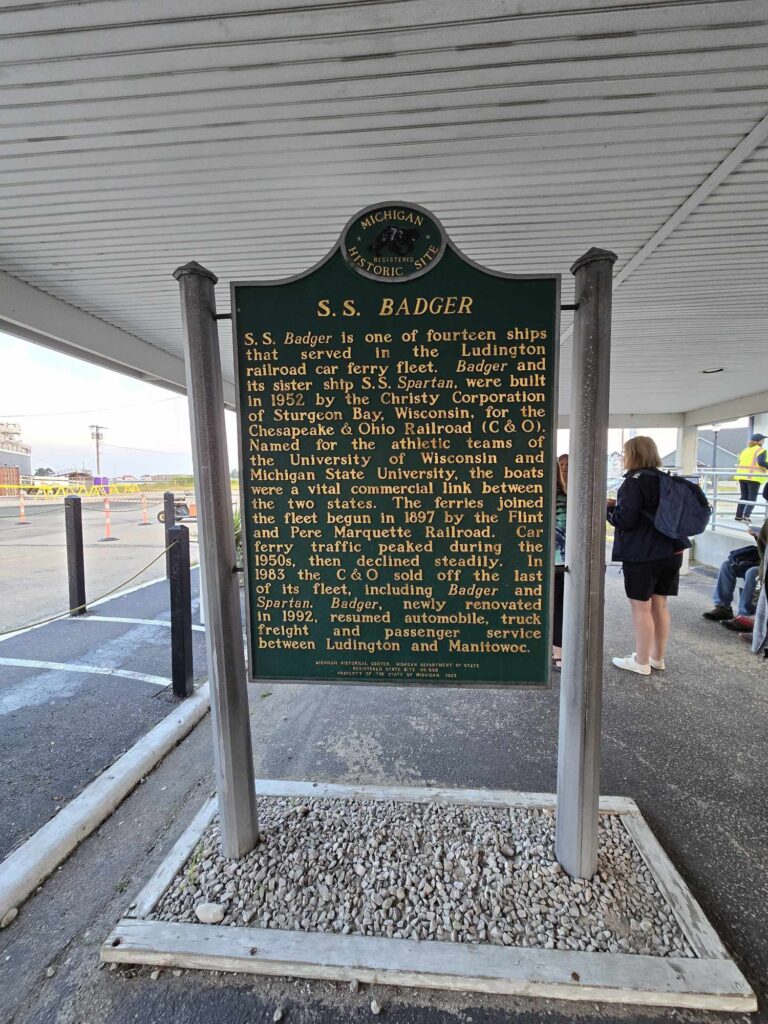 Michigan Registered Historic Site marker for SS Badger at Ludington dock describing history of Chesapeake and Ohio Railroad car ferry