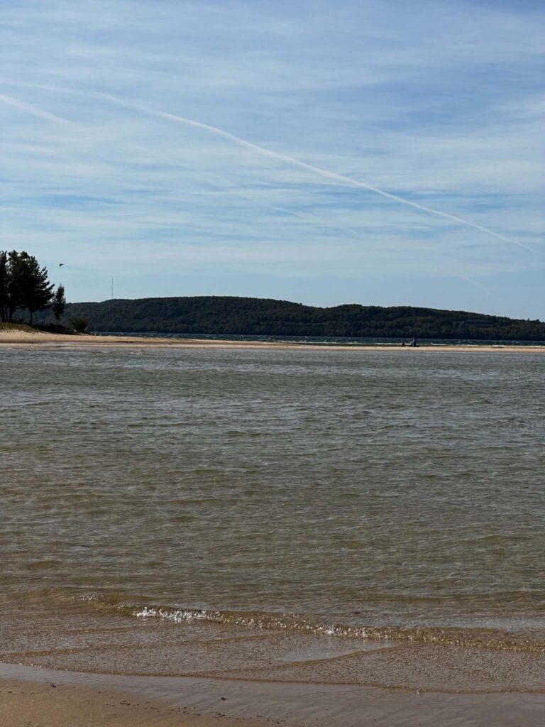 Calm Lake Superior beach near Pictured Rocks with sandy spit and
wooded hills