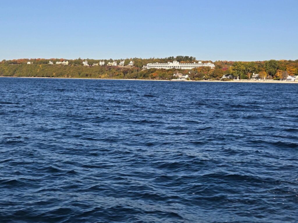 The Grand Hotel on Mackinac Island surrounded by autumn colors in October